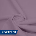 A swirled piece of matte nylon spandex fabric in the color plush.