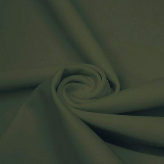 A swirled piece of matte nylon spandex fabric in the color sage.