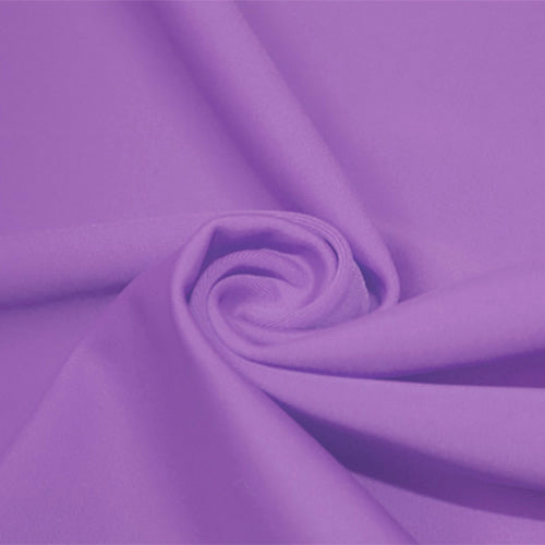 A swirled piece of matte nylon spandex fabric in the color spring fairy.