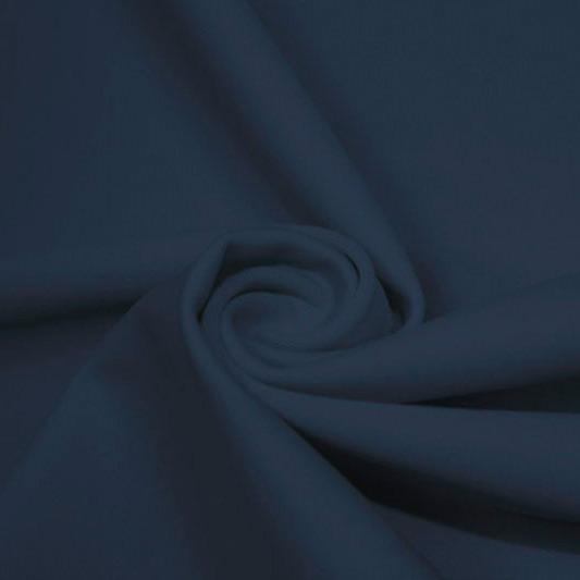 A swirled piece of matte nylon spandex fabric in the color steel blue.
