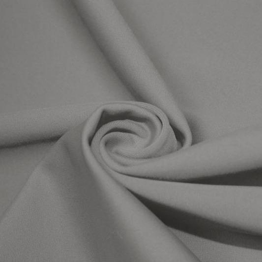 A swirled piece of matte nylon spandex fabric in the color stone.