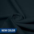 A swirled piece of matte nylon spandex fabric in the color symphony.