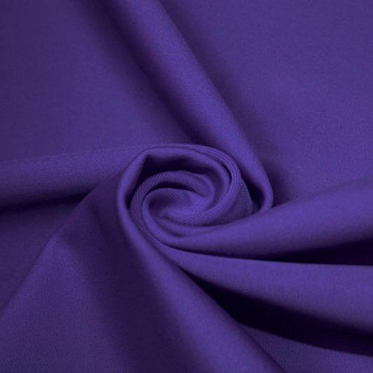 A swirled piece of matte nylon spandex fabric in the color violet.