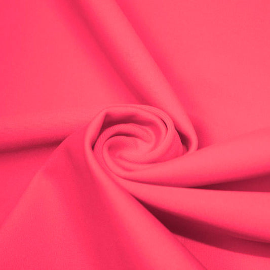 A swirled piece of matte nylon spandex fabric in the color wonderland.