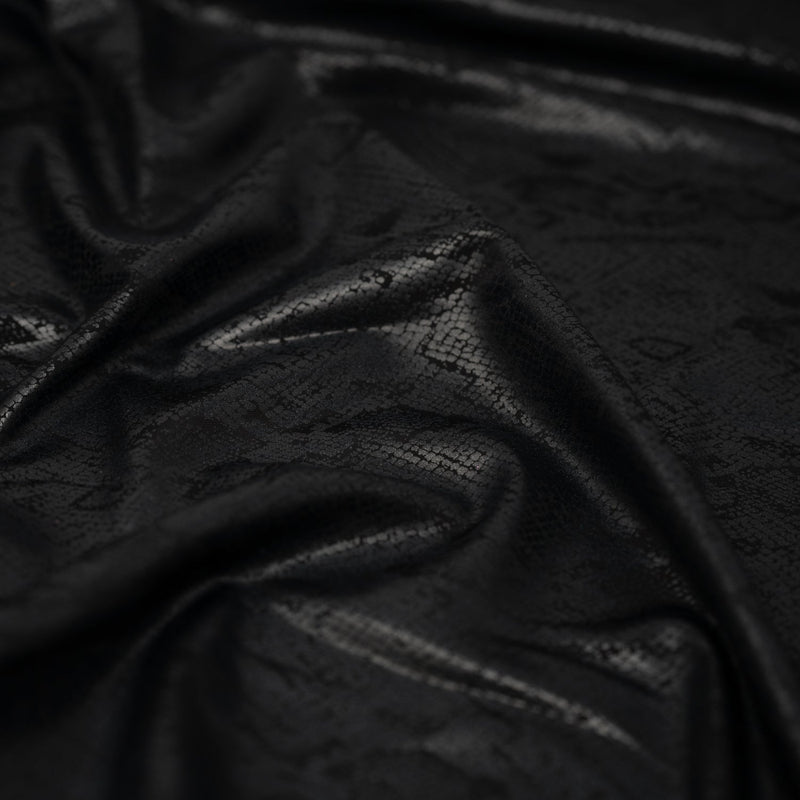 Detailed shot of Medusa Snake Skin Foil Printed Spandex in the color Black