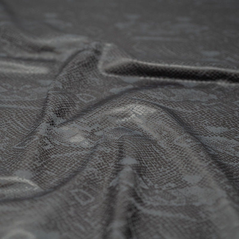 Detailed shot of Medusa Snake Skin Foil Printed Spandex in the color Grey
