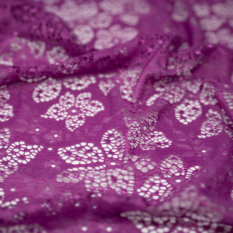 Detailed shot of Meghan Stretch Lace in color Magenta.