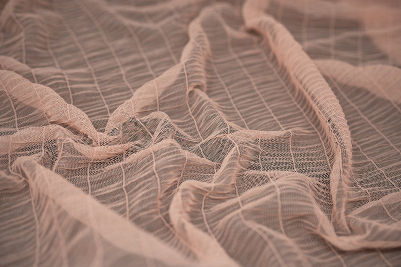 Detailed shot of Melody Gathered Stretch Mesh in color Peach.
