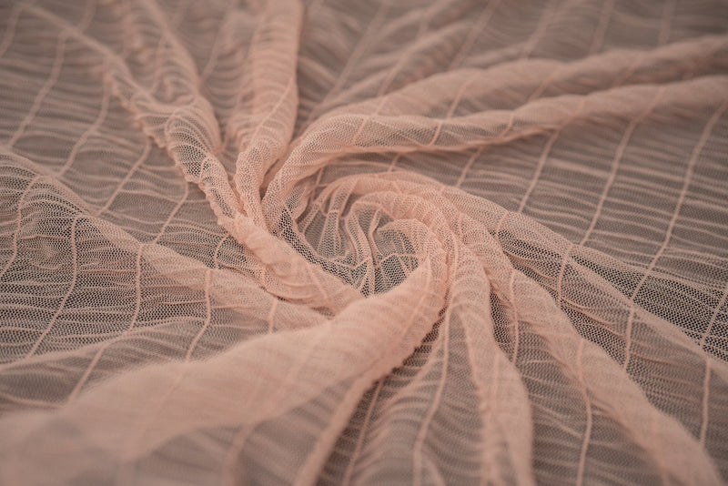 Detailed shot of Melody Gathered Stretch Mesh in color Peach.