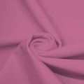 A swirled piece of microfiber nylon spandex in the color blush.
