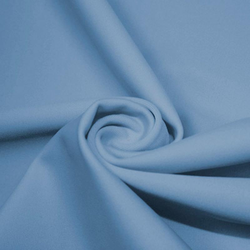 A swirled piece of microfiber nylon spandex in the color bouquet.