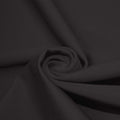 A swirled piece of microfiber nylon spandex in the color graphite.