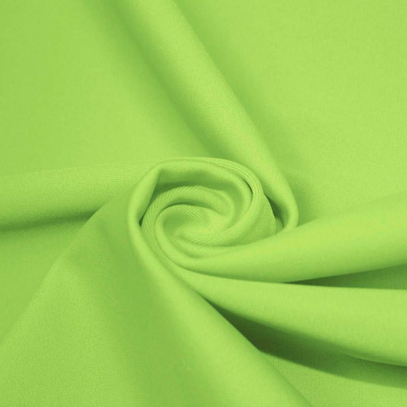 A swirled piece of microfiber nylon spandex in the color lime.