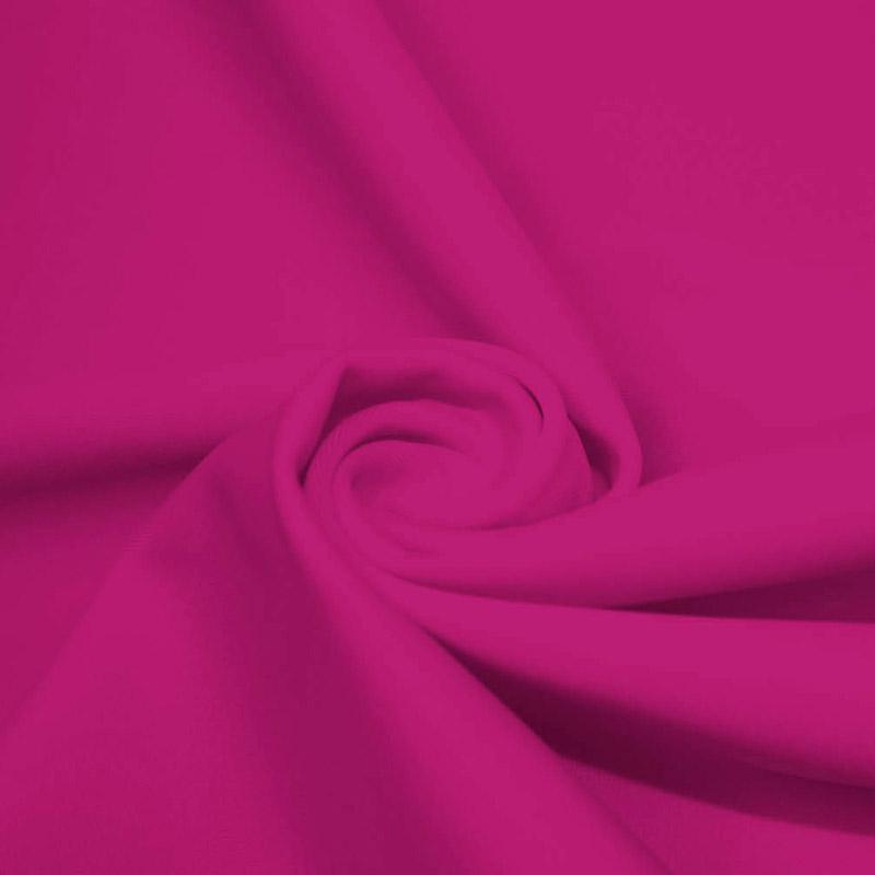 A swirled piece of microfiber nylon spandex in the color mixed pink.