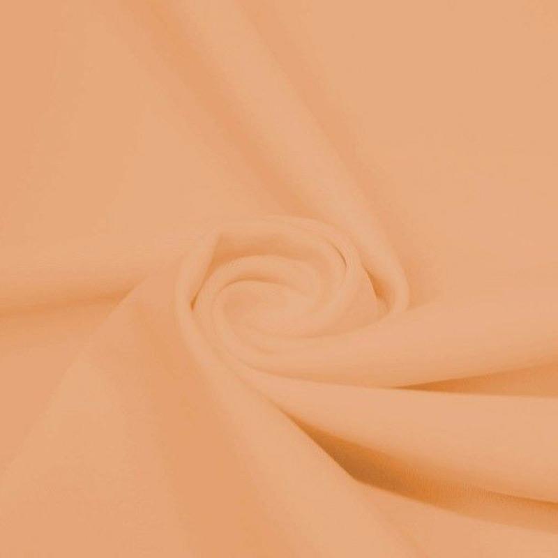 A swirled peice of microfiber nylon spandex in the color nude.
