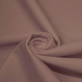 A swirled piece of microfiber nylon spandex in the color pale iris.