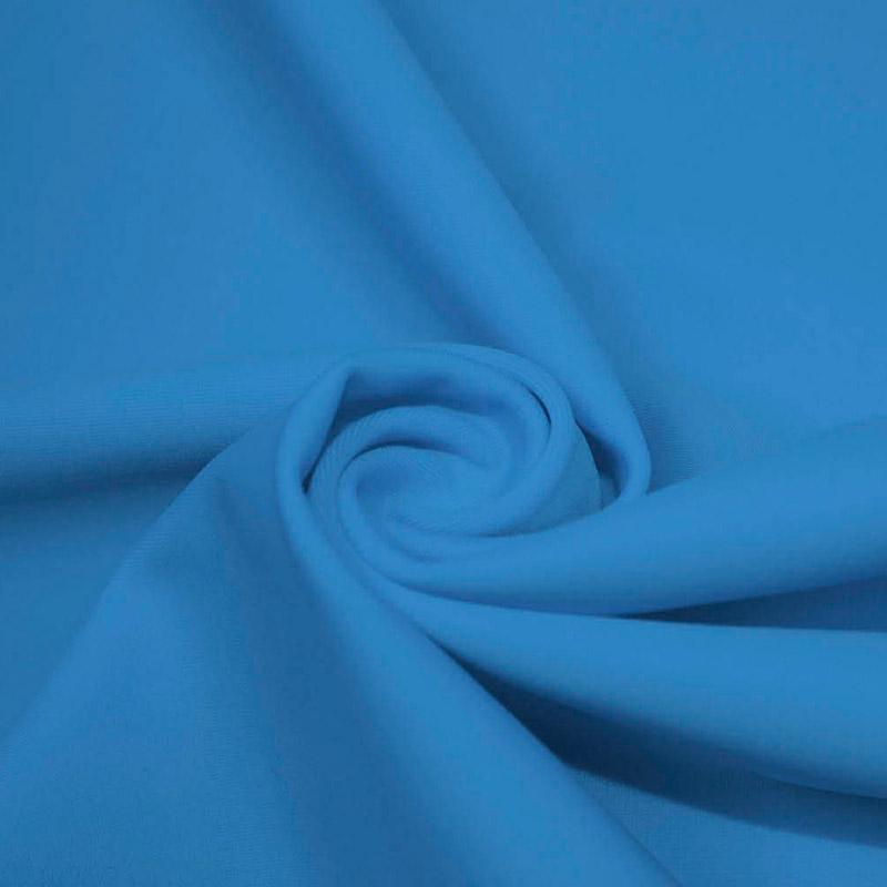 A swirled piece of microfiber nylon spandex in the color turquoise.