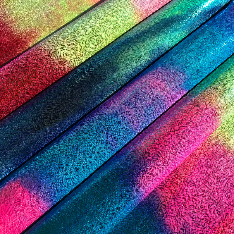 A flat sample of midnight blue tie-dyed foiled spandex in all available colors at blue moon fabrics.