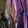A sample of ombre mystique foiled spandex in the color gunmetal-lavender.