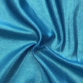 A swirled piece of Mystique Pearl foiled spandex with blue foil on an azul base.