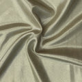 A swirled piece of Mystique Pearl foiled spandex with gold foil on a champagne base.
