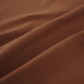 A swirled piece of Superflex Heavy Compression Spandex in the color coffee.