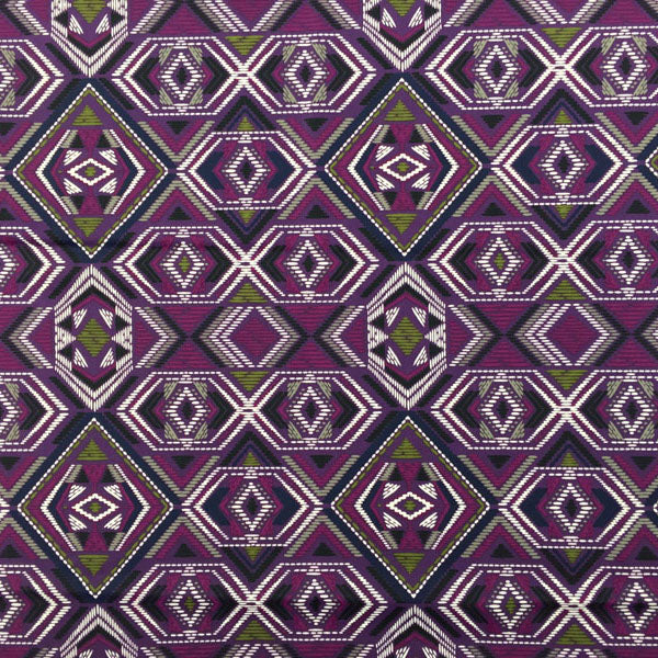 A flat sample of Purple and Green Tribal Printed Spandex.