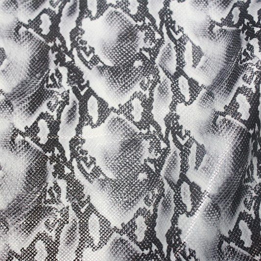 A flat sample of boa foiled spandex in the color black/grey.