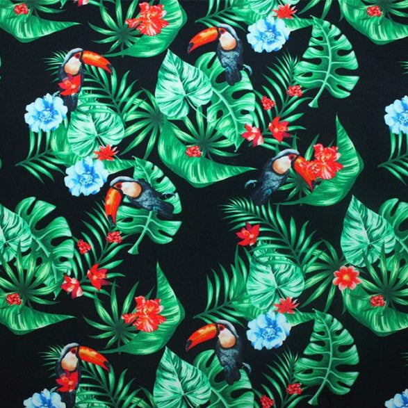 A flat sample of tropical toucans printed spandex.