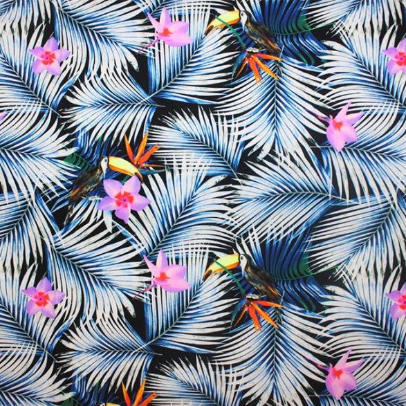 A flat sample of toucans on palms printed spandex.