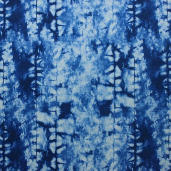 A flat sample of indigo tie-dye printed spandex.