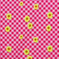 A flat sample of daisies on gingham printed spandex in the color red and yellow.