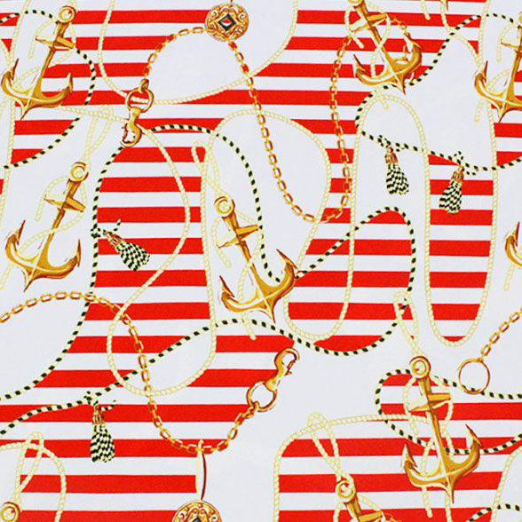 A flat sample of anchors and nautical stripes printed spandex in the color red-gold.