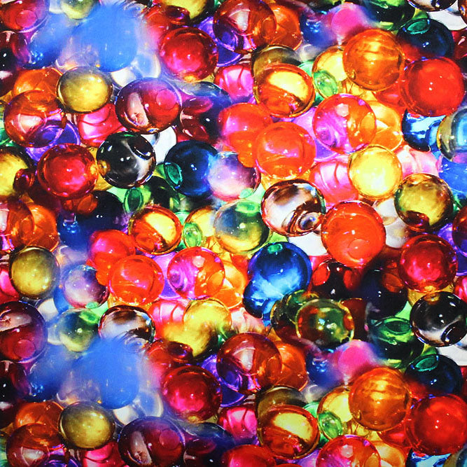 A flat sample of glass marbles printed spandex.