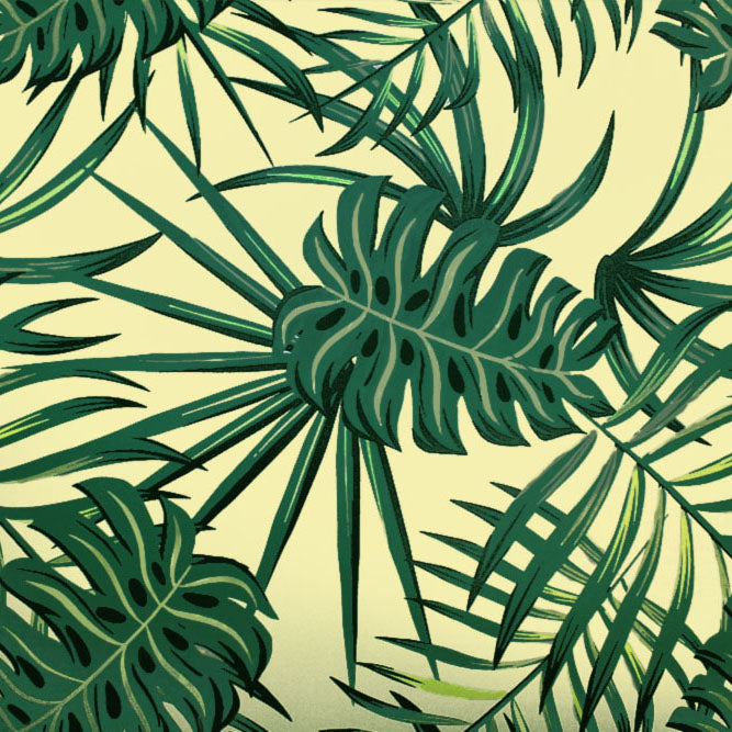 A flat  sample of palm fronds and monstera printed spandex.