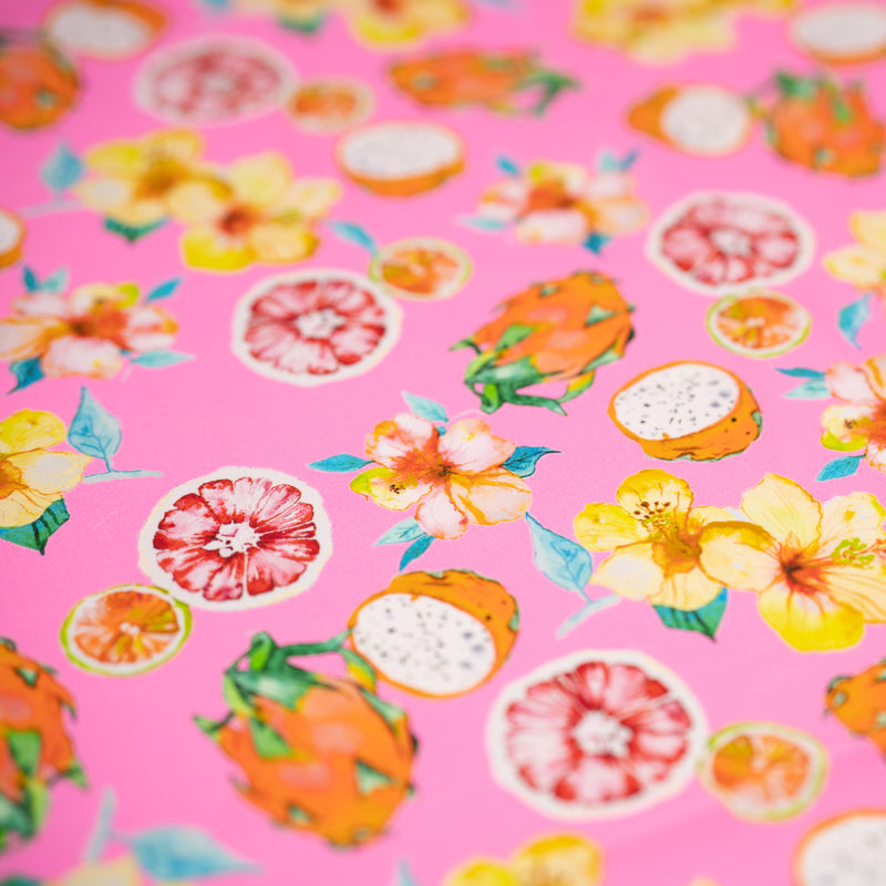 Detailed shot of Exotic Fruits and Yellow Hibiscus Flowers on Pink Printed Spandex.