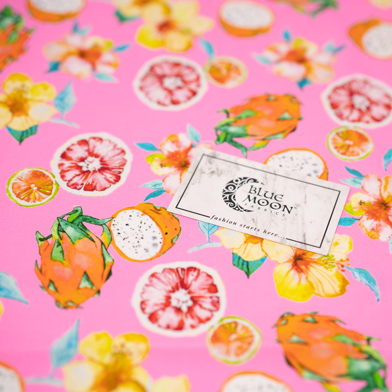 Detailed shot of Exotic Fruits and Yellow Hibiscus Flowers on Pink Printed Spandex.