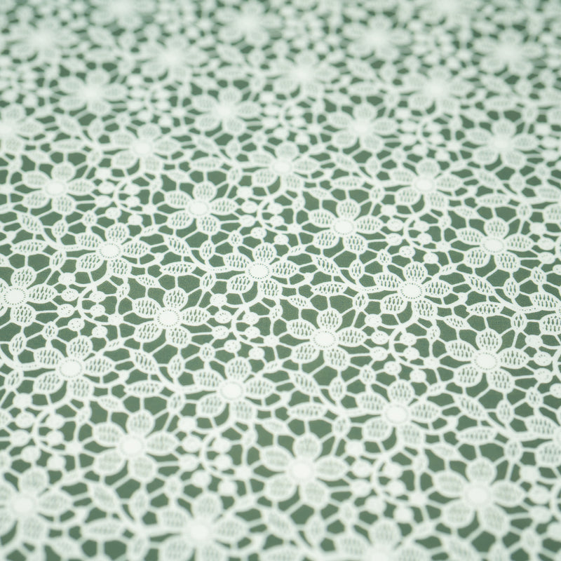 A flat sample of White Flower Lace Pattern on Sage Printed Spandex