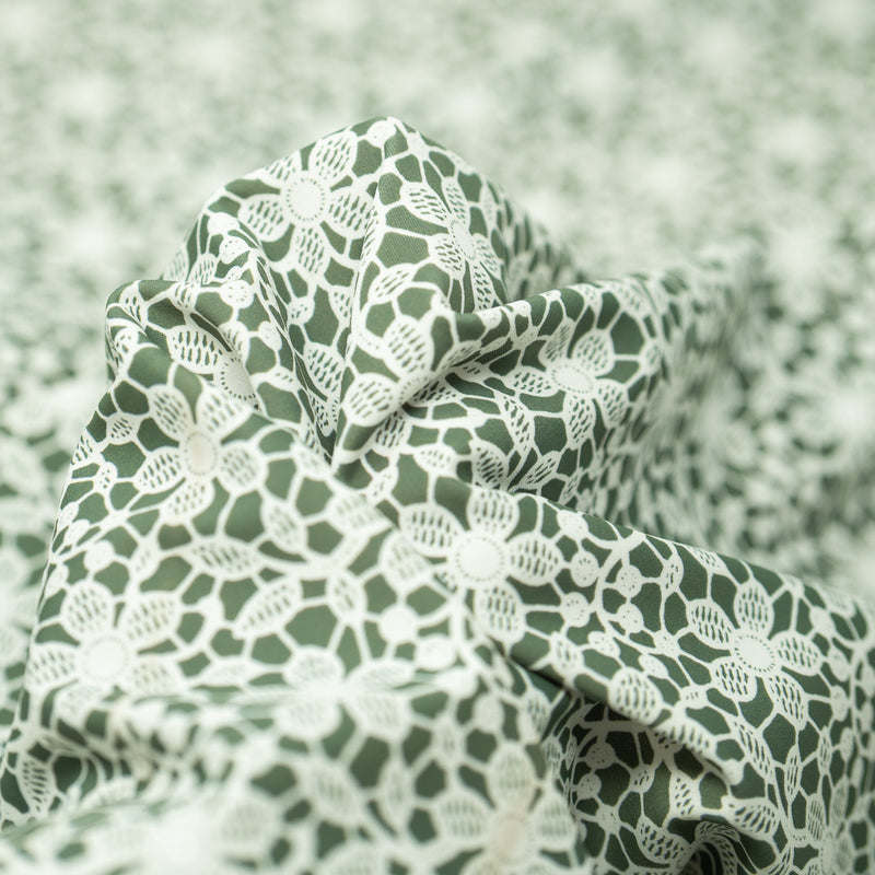 Detailed photograph of White Flower Lace Pattern on Sage Printed Spandex