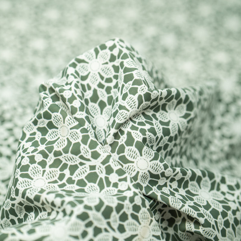 Detailed shot of White Flower Lace Pattern on Sage Printed Spandex