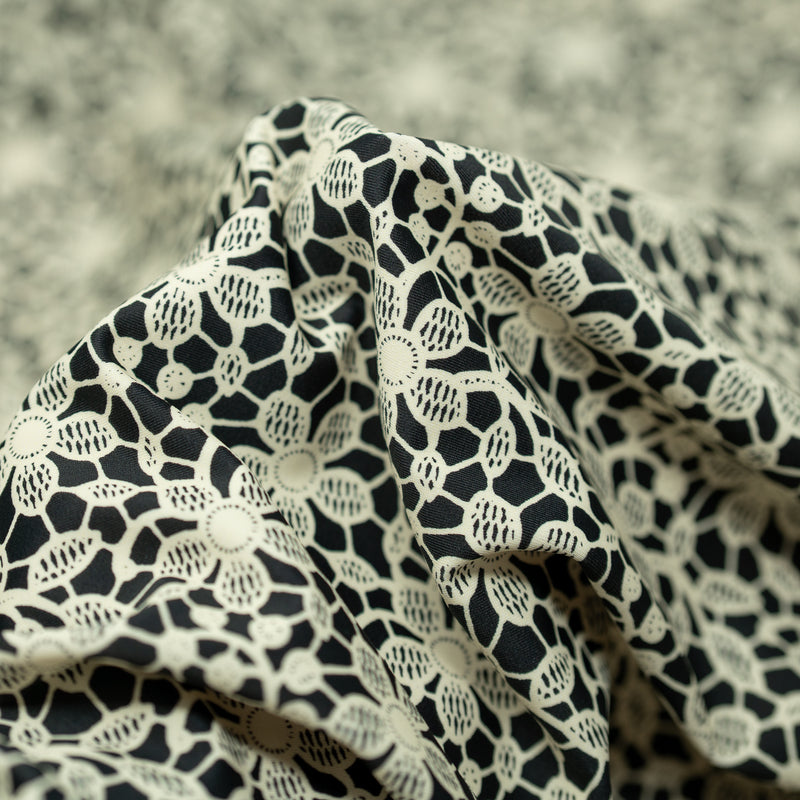 Detailed interior shot of Ivory Flower Lace Pattern on Black Printed Spandex