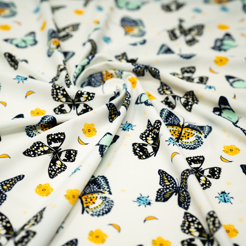 A swirled piece of Butterflies and Ladybugs Printed Spandex