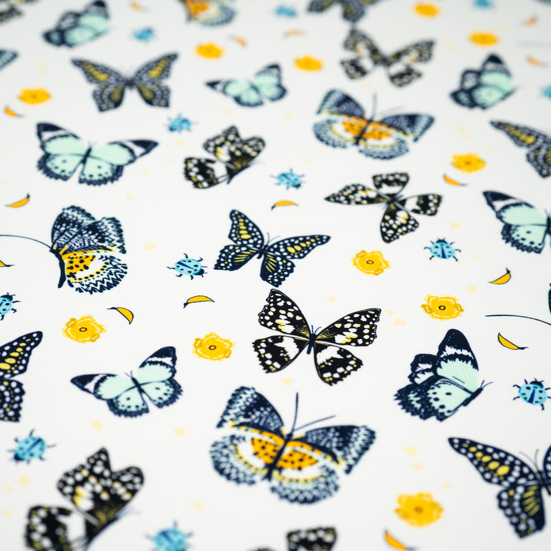 A flat sample of Butterflies and Ladybugs Printed Spandex