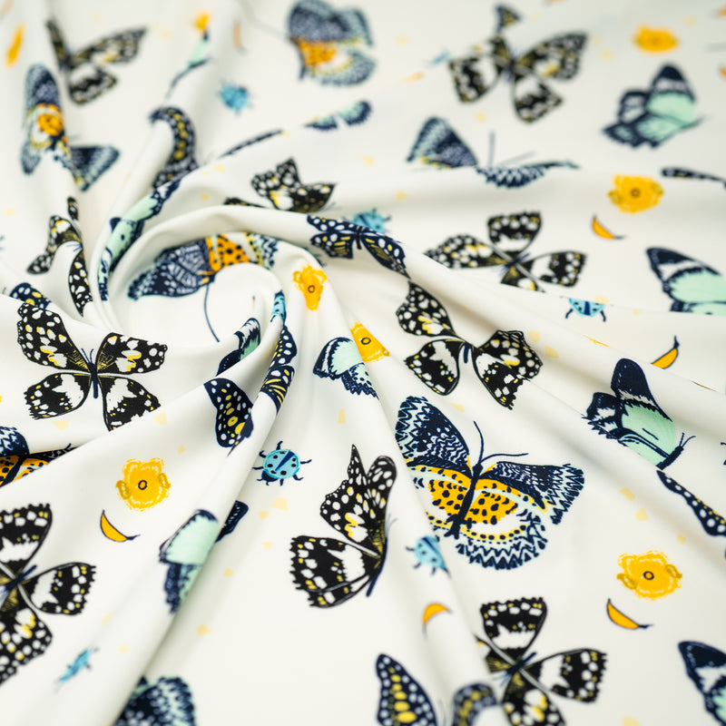 A swirled piece of Butterflies and Ladybugs Printed Spandex