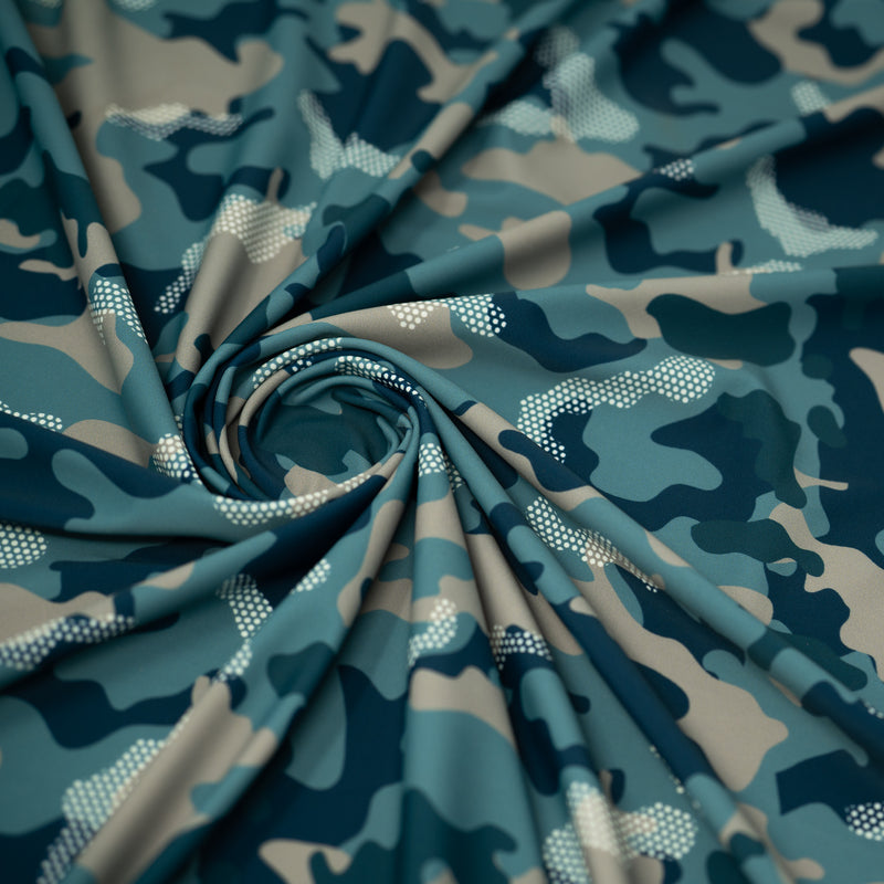 Swirled sample shot of Fiji Camouflage Printed Spandex in the color navy-blue-white-brown