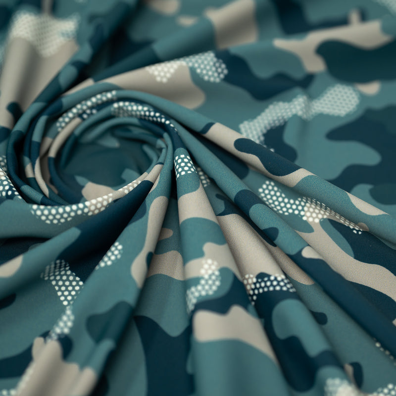Swirled sample shot of Fiji Camouflage Printed Spandex in the color navy-blue-white-brown
