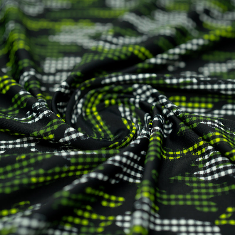A swirled piece of Camouflage Plaid Printed Spandex