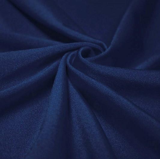 A swirled piece of shiny nylon spandex in the color denim.