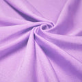 A swirled piece of shiny nylon spandex in the color spring fairy.