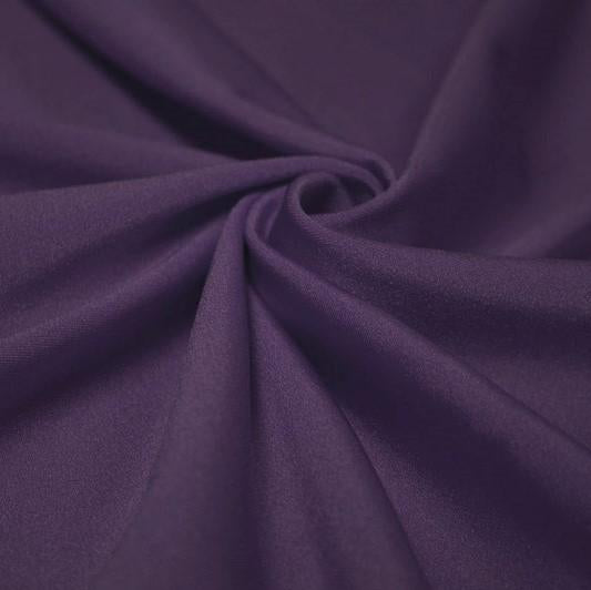 A swirled piece of shiny nylon spandex in the color violet.
